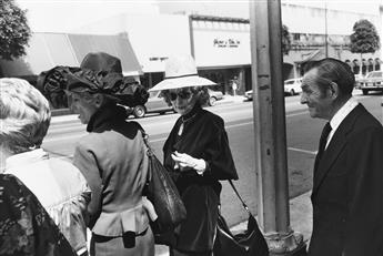 GARRY WINOGRAND (1928-1984) A group of 13 select photographs depicting street scenes in Californa, New York, and Texas.